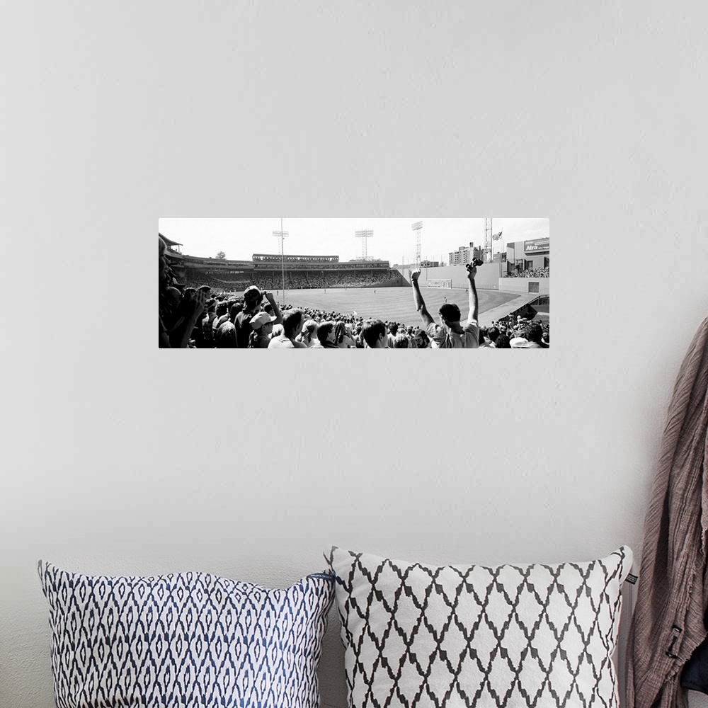 A bohemian room featuring Big, panoramic black and white photograph of Fenway Park in Boston, with fans standing and cheeri...