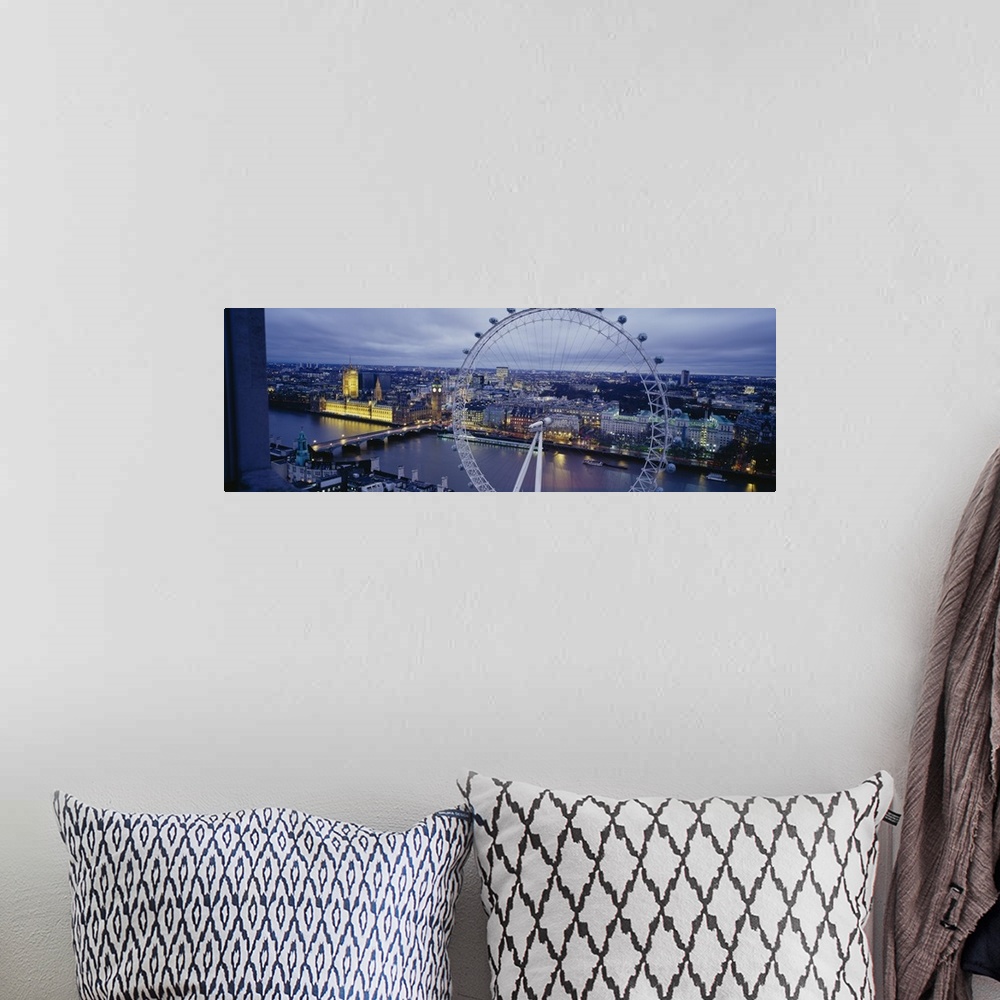 A bohemian room featuring This is a city scape panoramic that showcases several city landmarks in the twilight.
