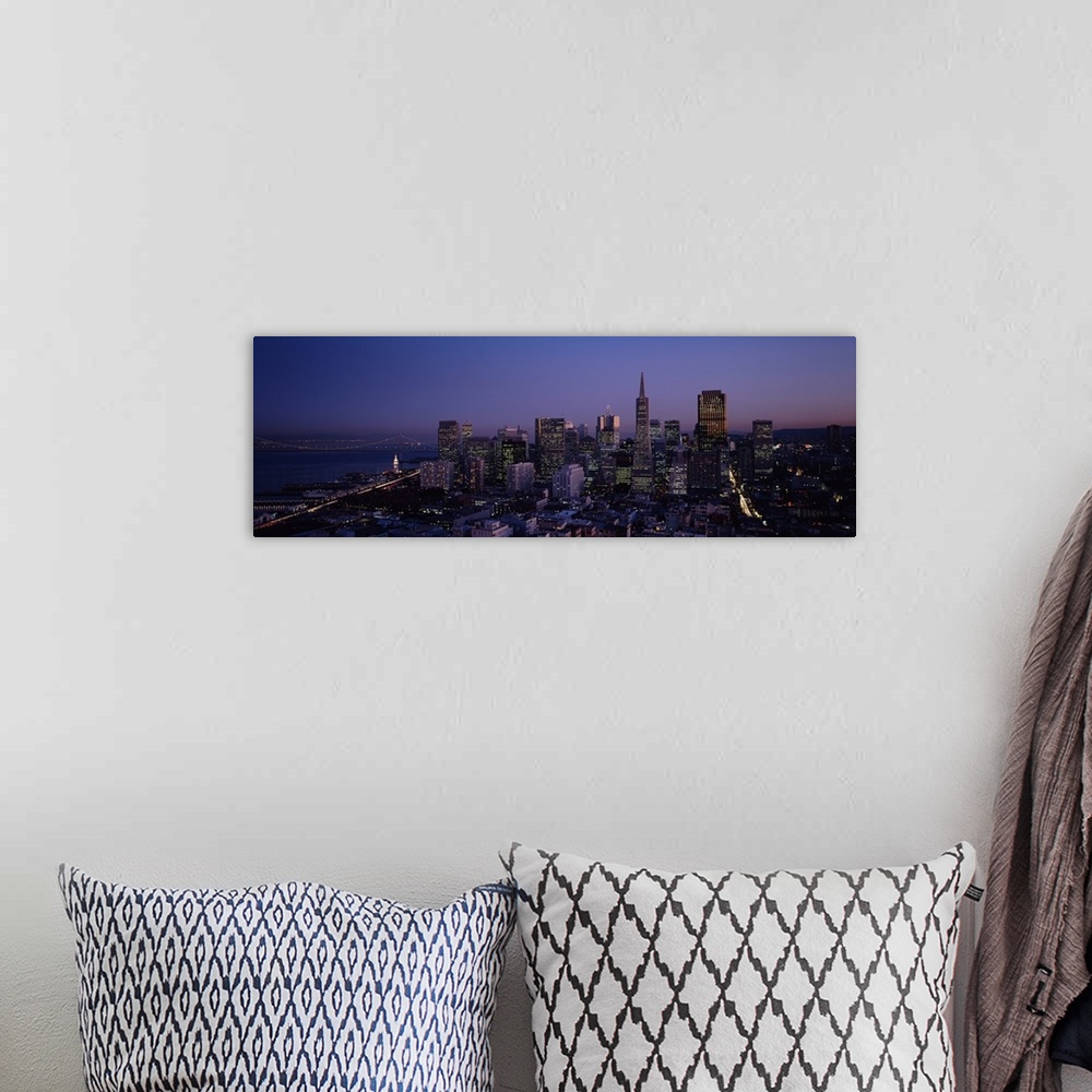 A bohemian room featuring Aerial photograph taken of the San Francisco skyline illuminated under a night sky.