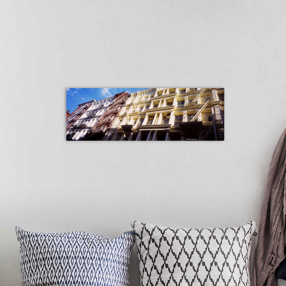 A bohemian room featuring Up-close panoramic photograph of row houses in The Big Apple.