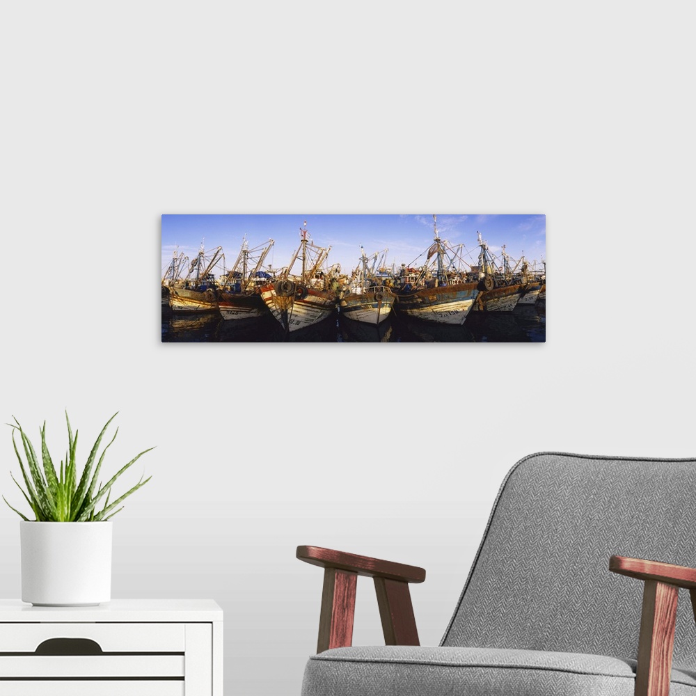 A modern room featuring Fishing boats moored at a harbor, Essaouira, Morocco