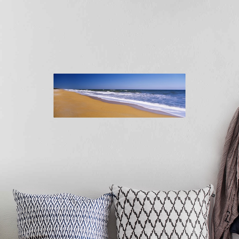 A bohemian room featuring Wide angle photograph of the shoreline of Flagler Beach, the waves of the Atlantic Ocean crashing...