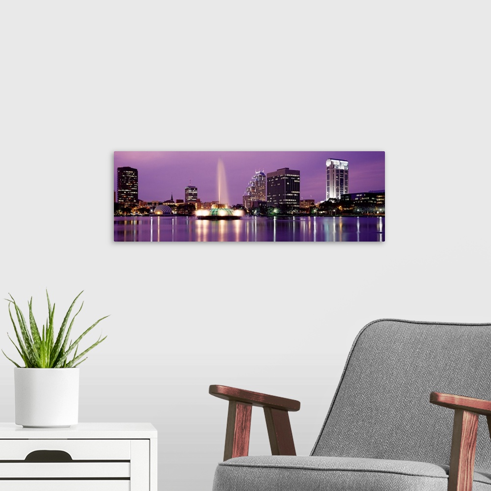 A modern room featuring Florida, Orlando, View of a city skyline at night