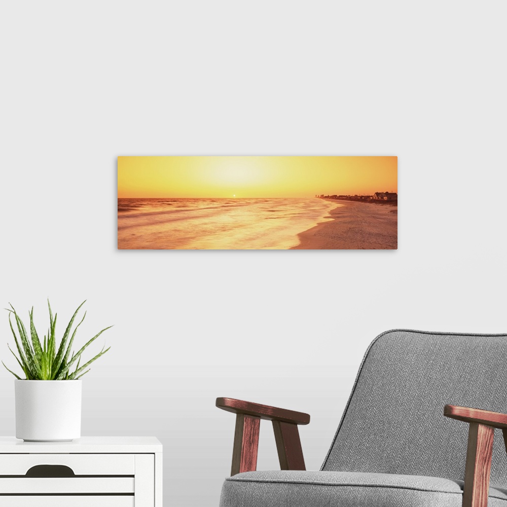 A modern room featuring Florida, View of sunset from a beach