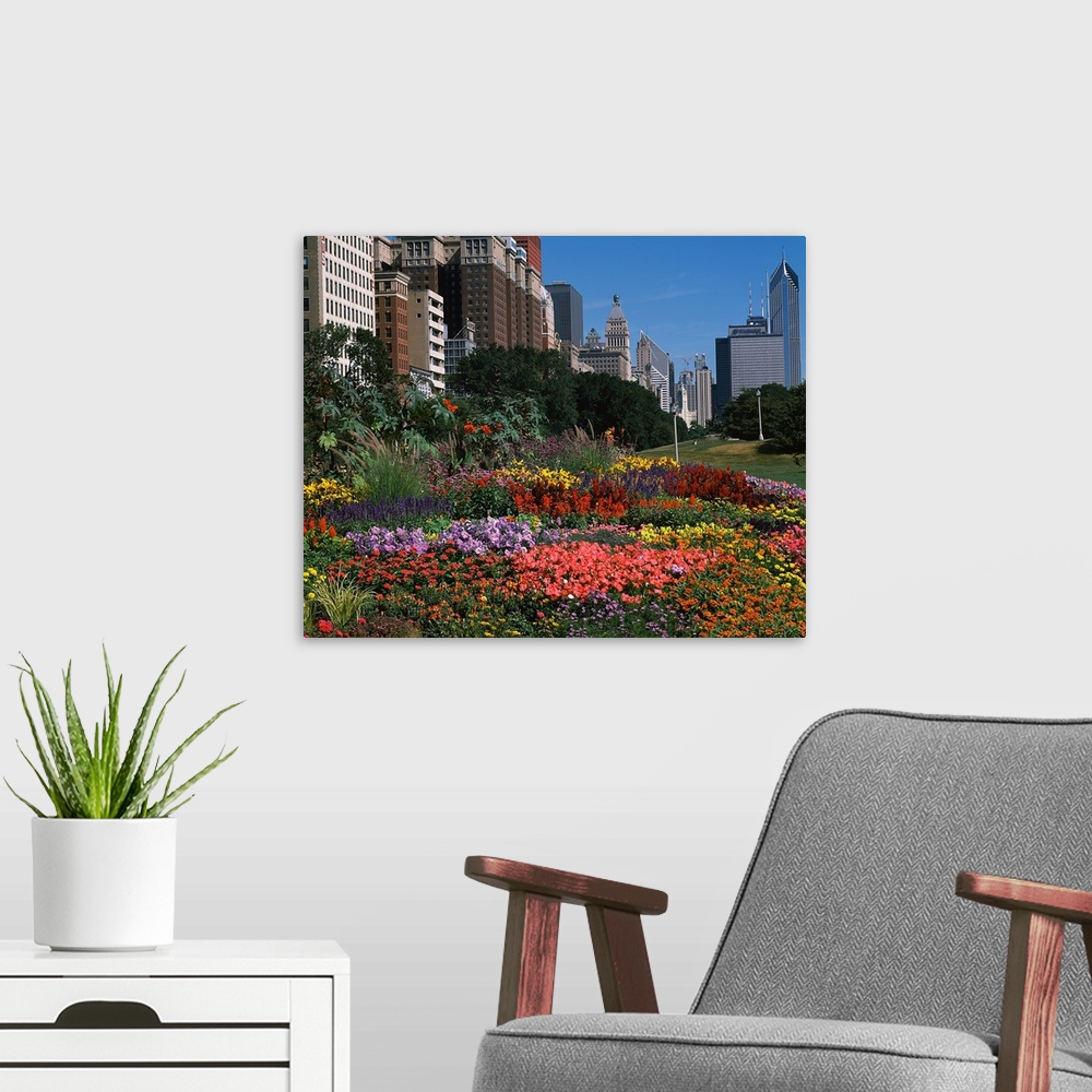 A modern room featuring A variety of flowers are photographed closely with a city skyline in the background.