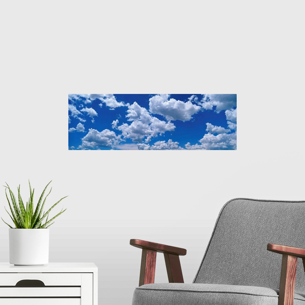 A modern room featuring Fluffy Clouds in Fair Weather Sky