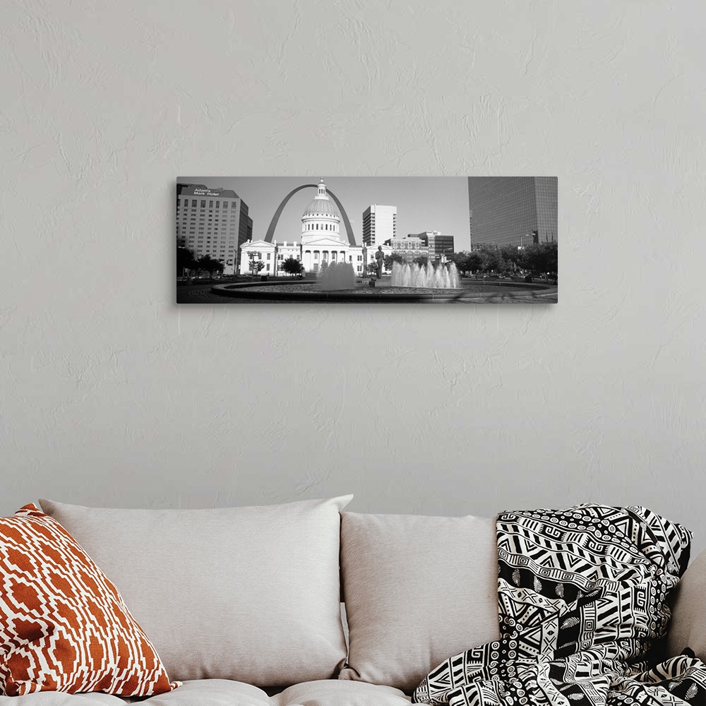 A bohemian room featuring A panoramic view of St. Louis Missouri's capitol building, with the Saint Louis arch in the backg...