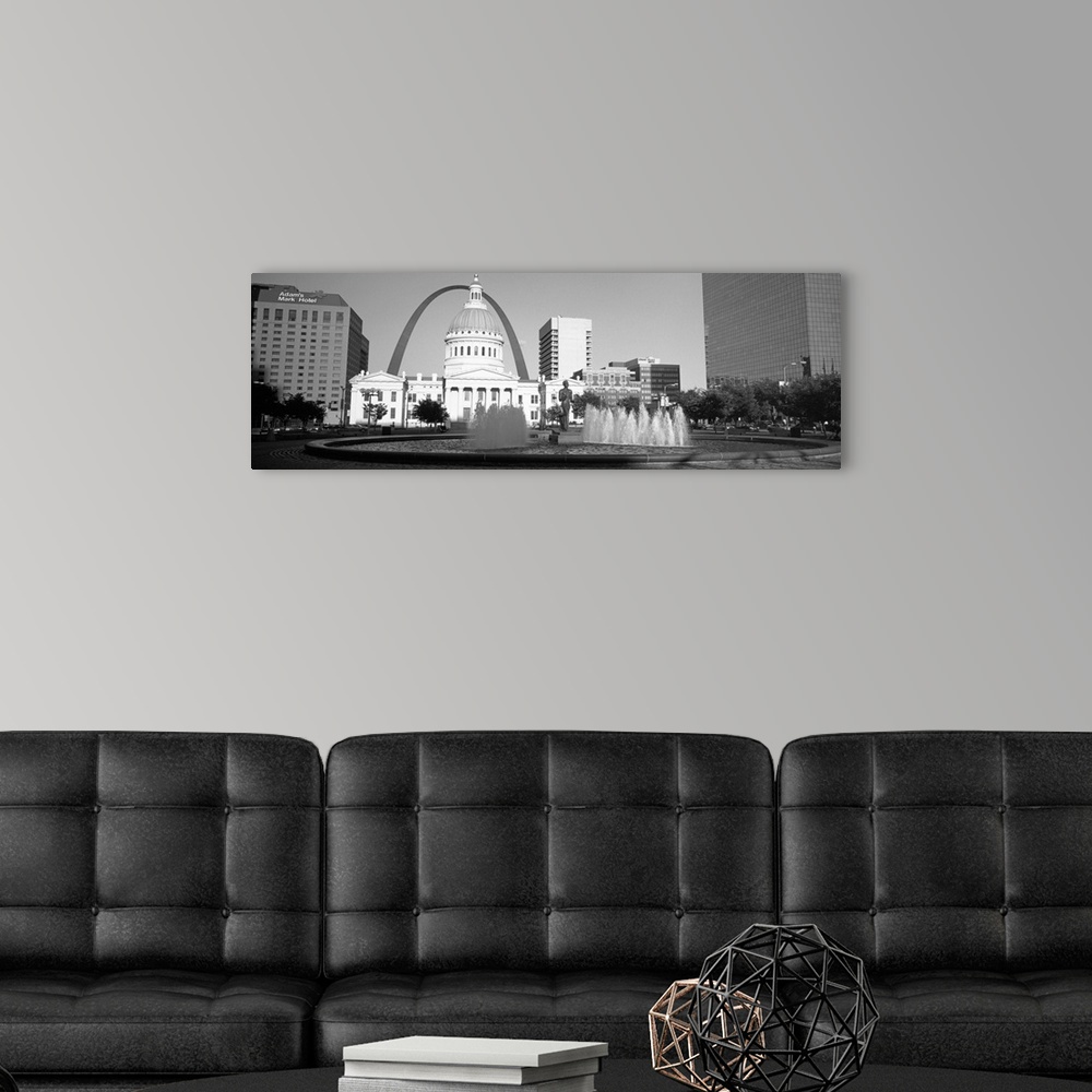 A modern room featuring A panoramic view of St. Louis Missouri's capitol building, with the Saint Louis arch in the backg...