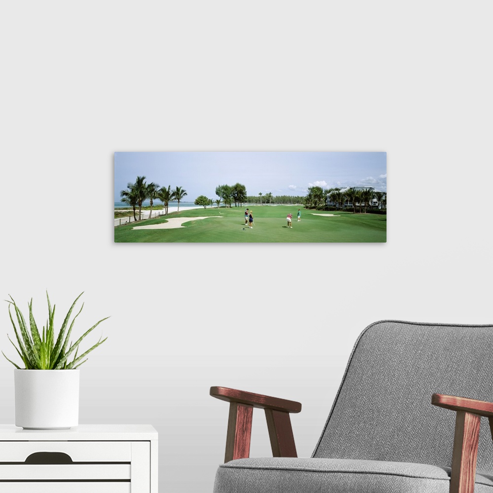 A modern room featuring Four people playing golf, South Seas Plantation, Captiva Island, Florida