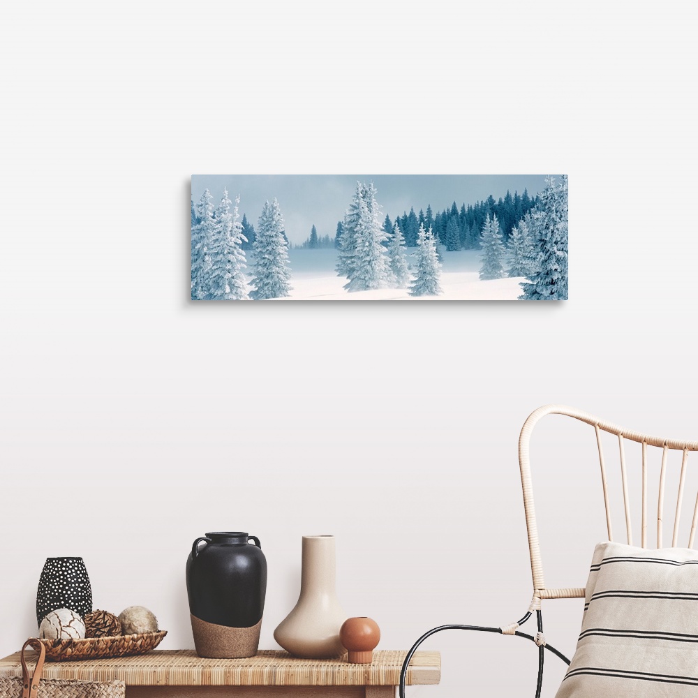 A farmhouse room featuring Panoramic photograph displays a Winter landscape of trees that have been covered in a blanket of ...