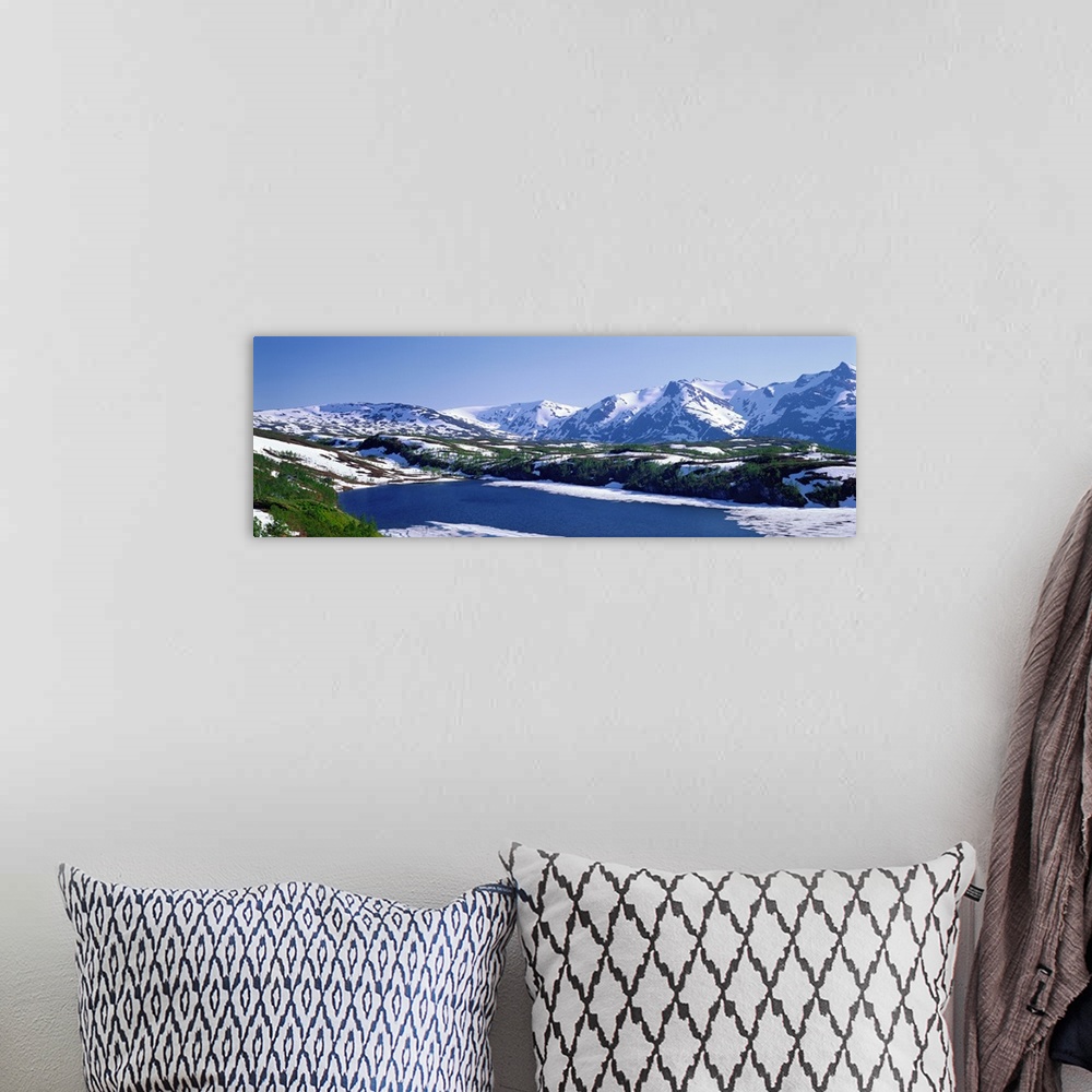 A bohemian room featuring Frozen Mountain Lake Norway