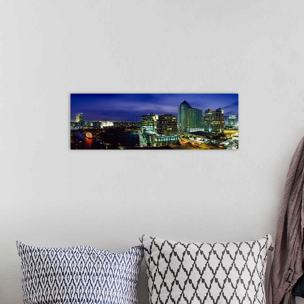 A bohemian room featuring Parts of the city of Ft. Lauderdale are illuminated under a night sky and shown in panoramic view.