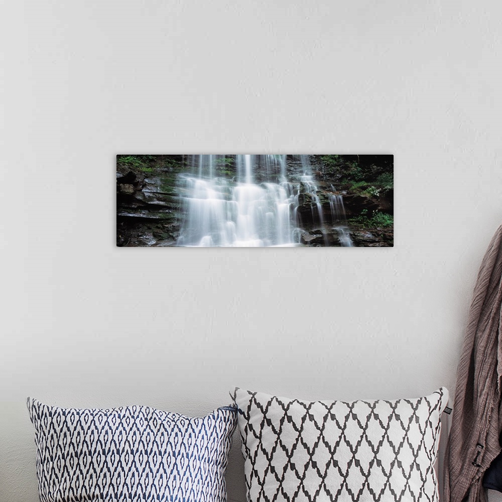 A bohemian room featuring Panoramic photo on canvas of water rushing down a rocky cliff in Pennsylvania.