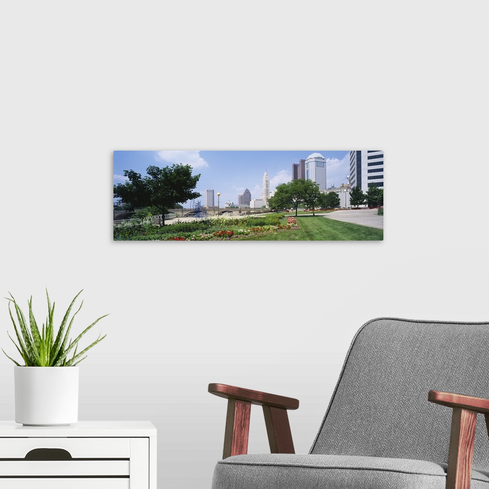 A modern room featuring Garden in front of skyscrapers in a city, Scioto River, Columbus, Ohio