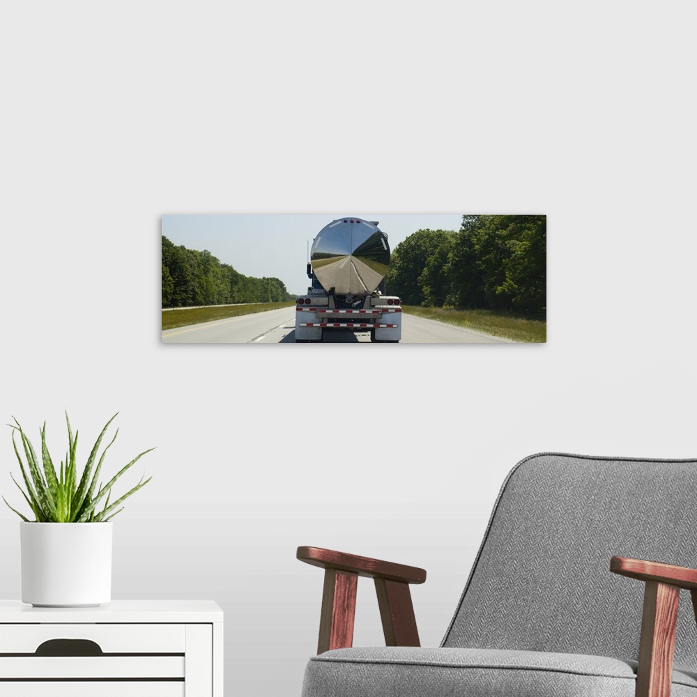 A modern room featuring Gas delivery truck moving on a highway