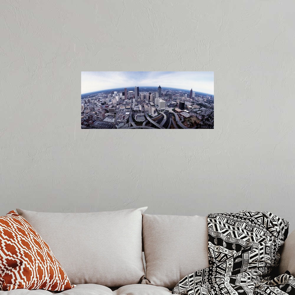 A bohemian room featuring High-angle panoramic view of town with tall buildings, skyscrapers, bridges, and waterfront.