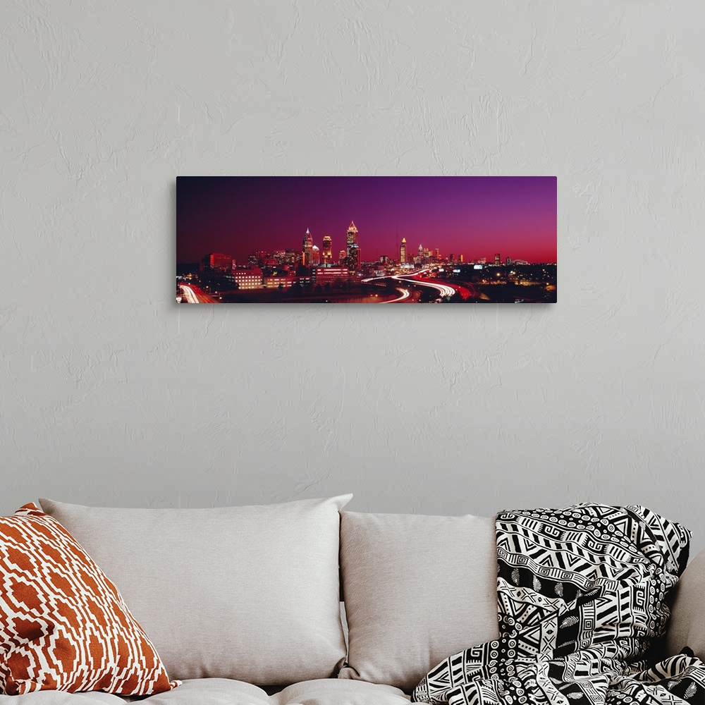 A bohemian room featuring Panoramic photograph displays the busy streets of a famous city in the Southeastern United States...