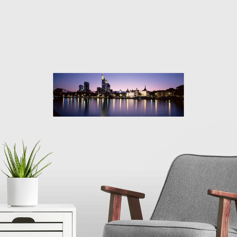 A modern room featuring Germany, Frankfurt, Main River, skyline in evening