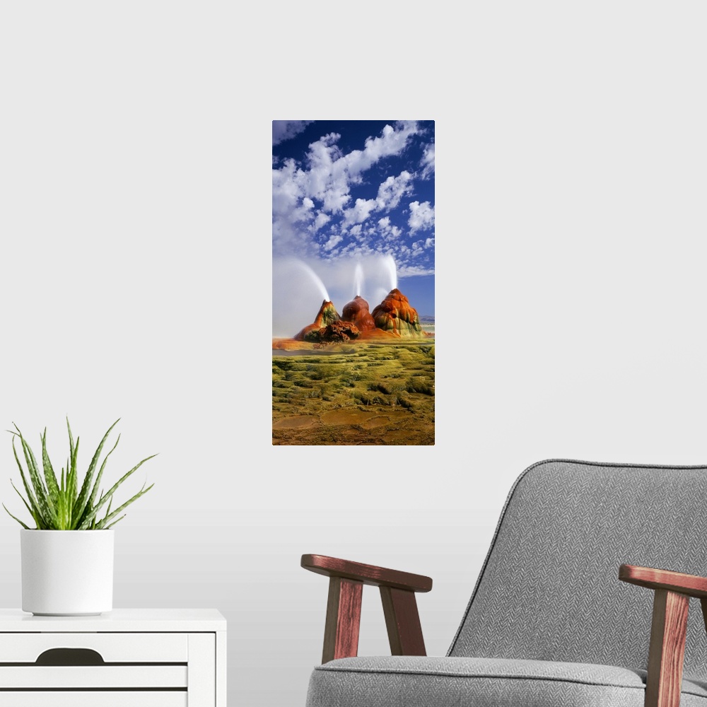 A modern room featuring Vertical panoramic photograph of huge rock formations in desert under a cloudy sky.