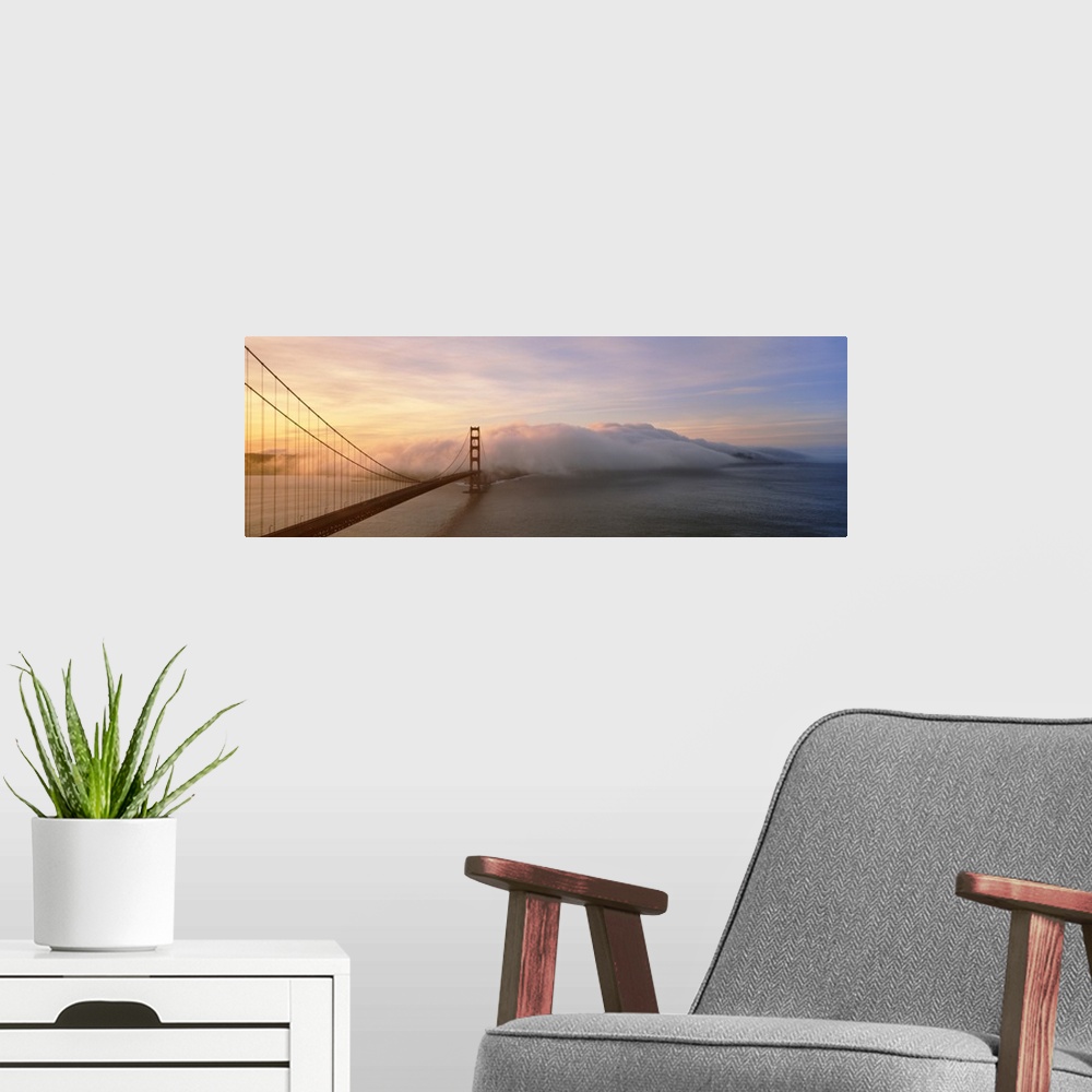 A modern room featuring Panorama of rolling fog over the Golden Gate Bridge in San Francisco, California.