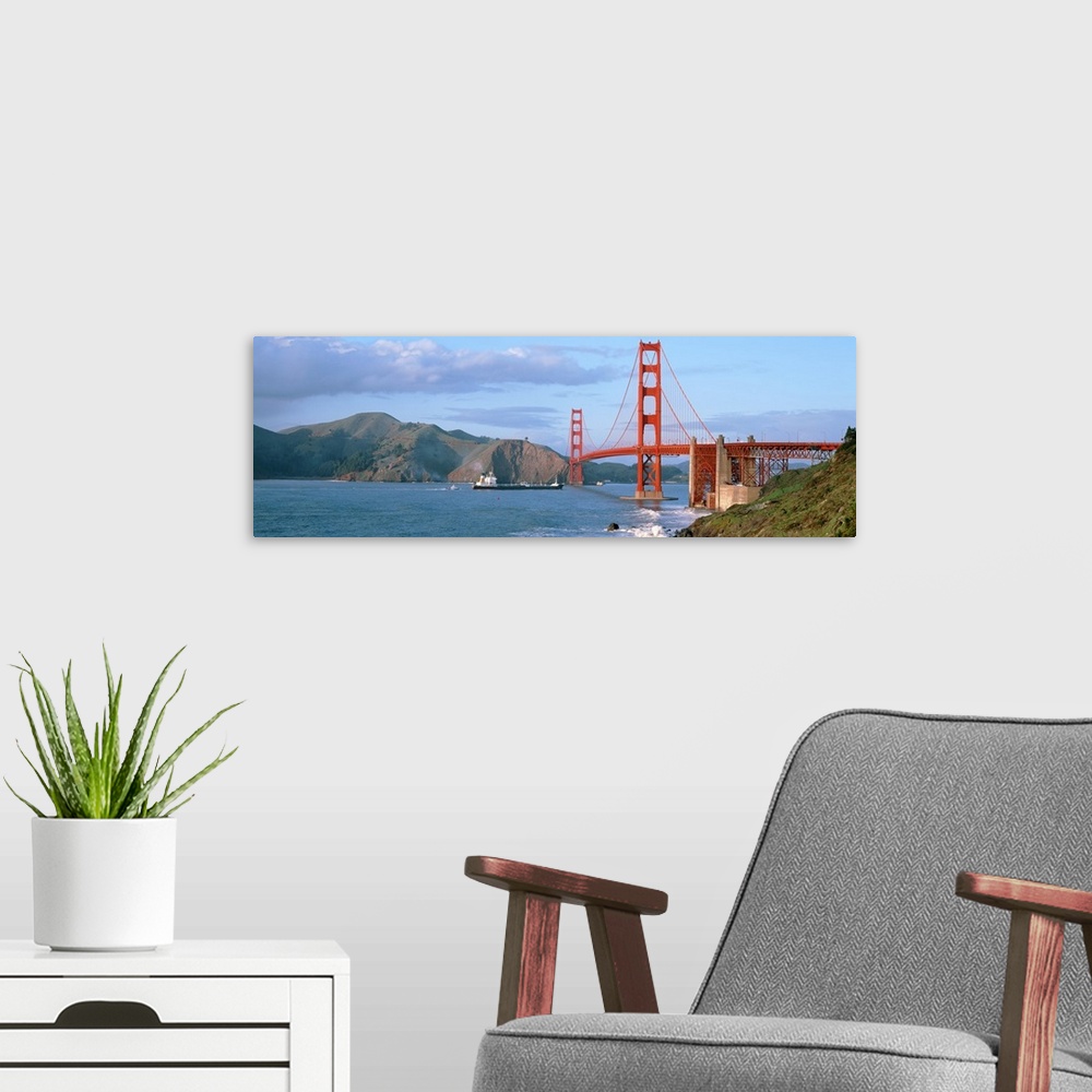 A modern room featuring Wide angle photograph of the San Francisco Bay and the Golden Gate Bridge, mountains on the horiz...