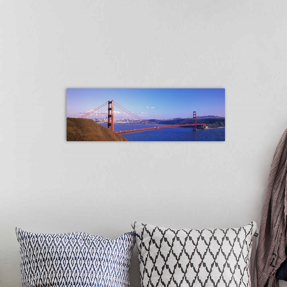 A bohemian room featuring Panoramic photo on canvas of the Golden Gate Bridge spanning from left to right with the city in ...