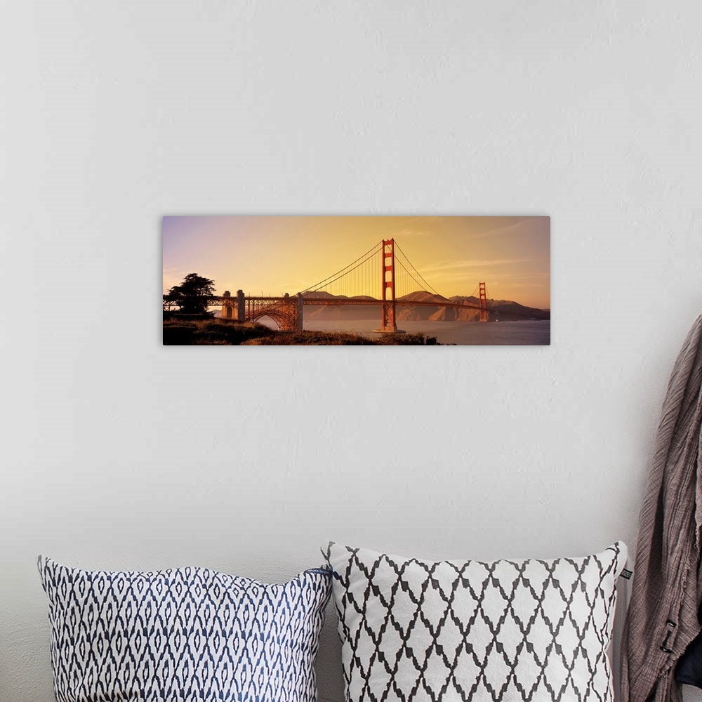 A bohemian room featuring Giant horizontal photograph of San Francisco Bay's suspension bridge, the Golden Gate Bridge, at ...