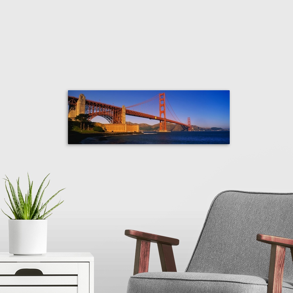 A modern room featuring Panorama of the Golden Gate Bridge over the San Francisco Bay in California.