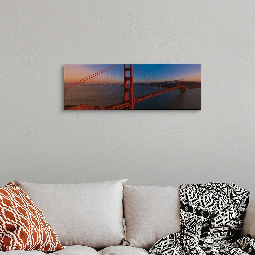 A bohemian room featuring Panoramic photograph of the iconic suspension bridge in California's Bay Area during sunset, with...