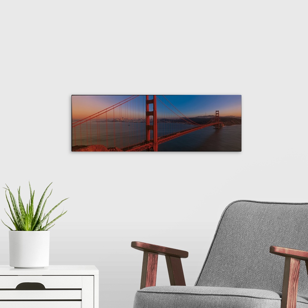 A modern room featuring Panoramic photograph of the iconic suspension bridge in California's Bay Area during sunset, with...