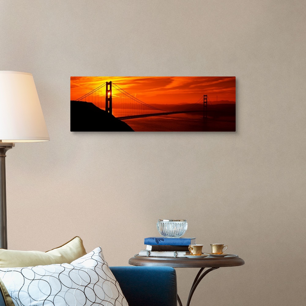 A traditional room featuring This oversized wall art is a panorama of San Francisco Bay at sunset where the suspension bridge ...