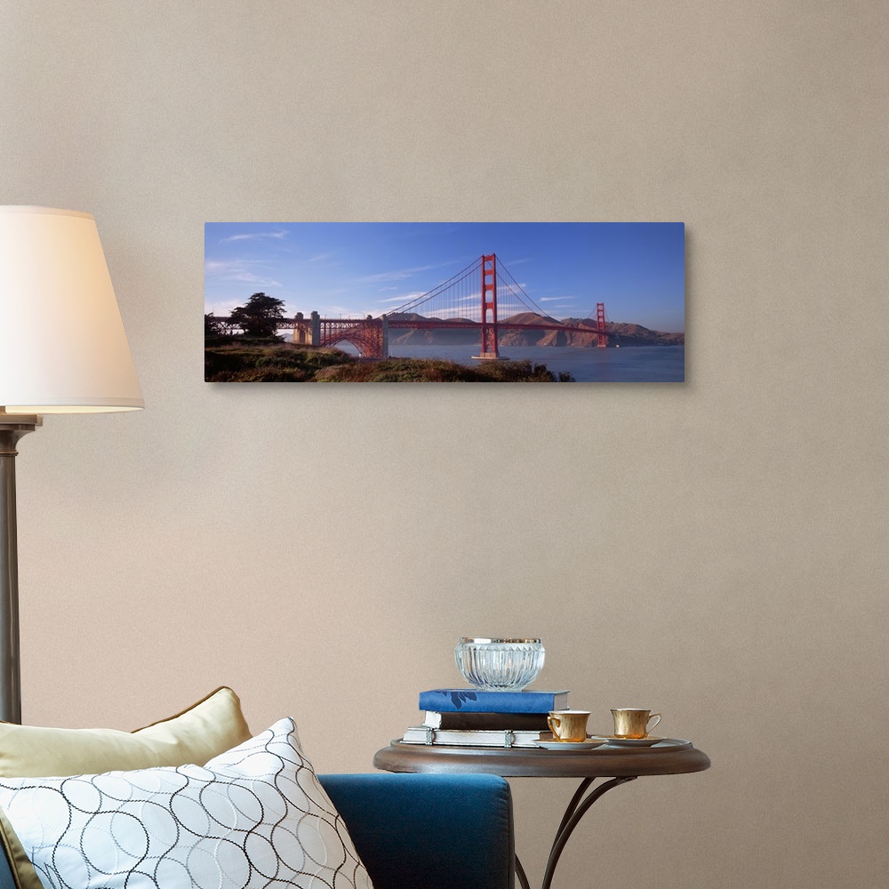 A traditional room featuring Panoramic photograph showcases a famous suspension bridge found within the Western United States ...