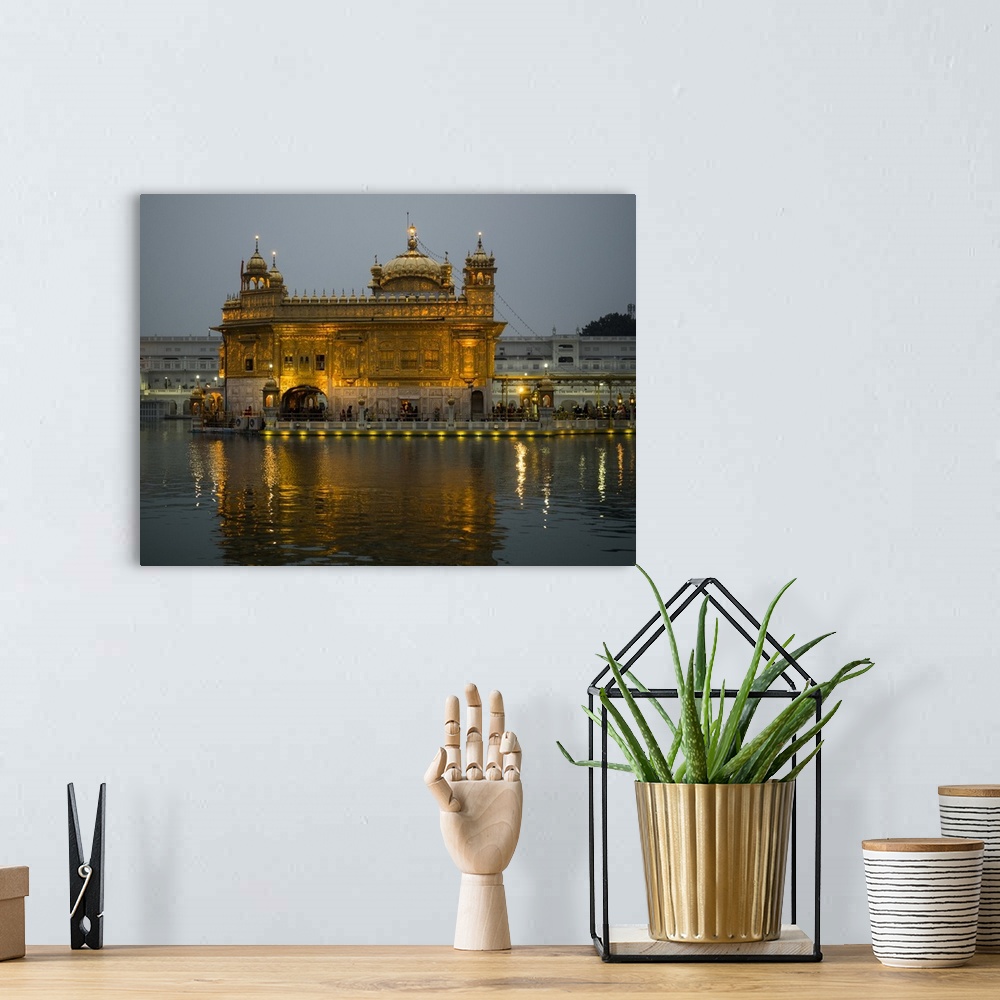A bohemian room featuring Golden Temple reflected in pool, Amritsar, Punjab, India.