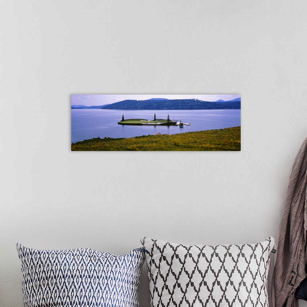 A bohemian room featuring Panoramic photo on canvas of a golf course on a small island in the middle of a lake with mountai...