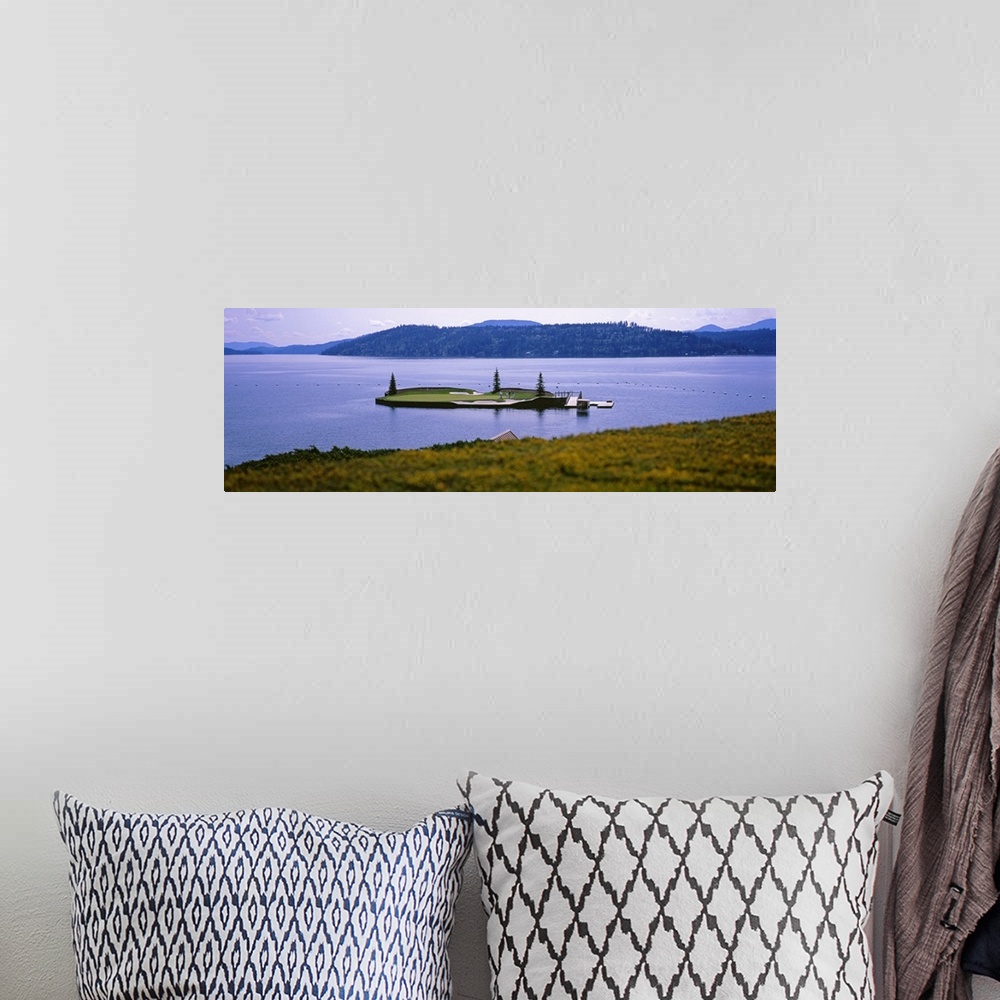 A bohemian room featuring Panoramic photo on canvas of a golf course on a small island in the middle of a lake with mountai...
