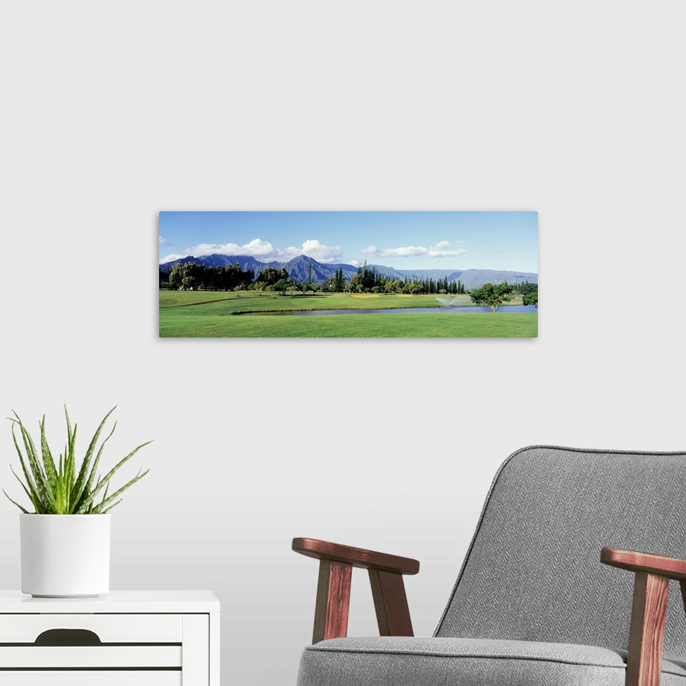 A modern room featuring Golf course in front of mountains, Princeville, Kauai, Hawaii