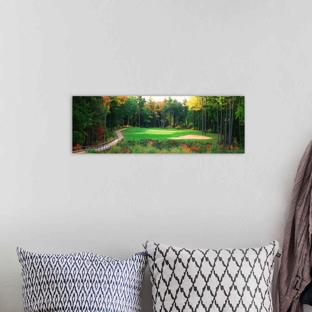 A bohemian room featuring Panoramic photo of a golf green in the Northern United States. A wooden bridge leads to the hole ...