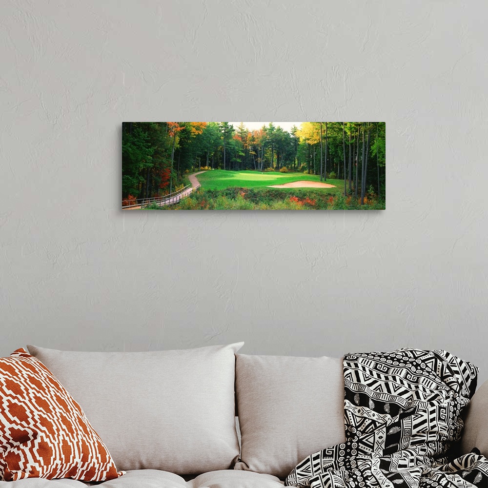 A bohemian room featuring Panoramic photo of a golf green in the Northern United States. A wooden bridge leads to the hole ...