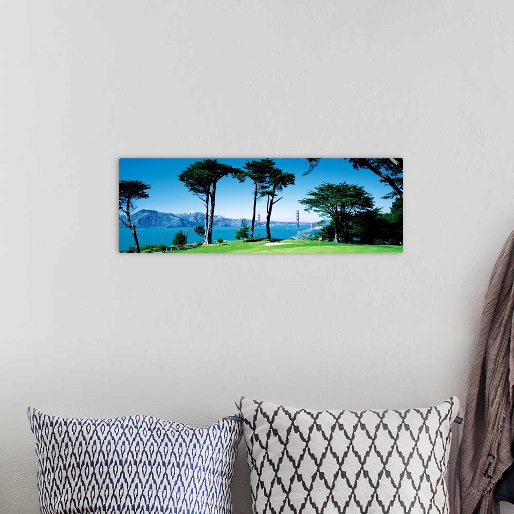 A bohemian room featuring Big panoramic photograph of a seaside golf course in San Francisco, California (CA) with mountain...