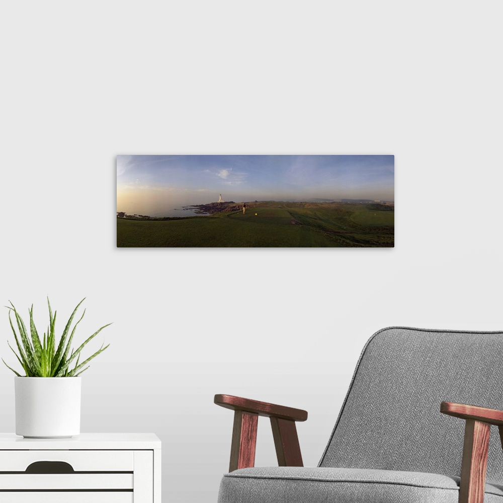 A modern room featuring Golf course with a lighthouse in the background, Turnberry, South Ayrshire, Scotland