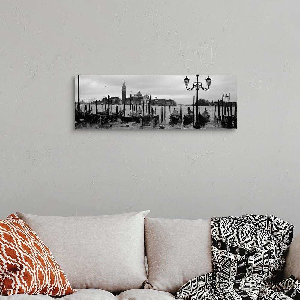 A bohemian room featuring Wide angle photograph of a line of gondolas parked near the shore, the Church Of San Giorgio Magg...