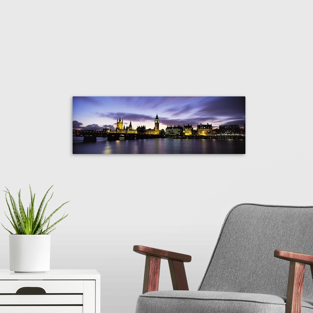 A modern room featuring Wide angle, nighttime photograph of the London skyline, including Big Ben and Houses of Parliamen...