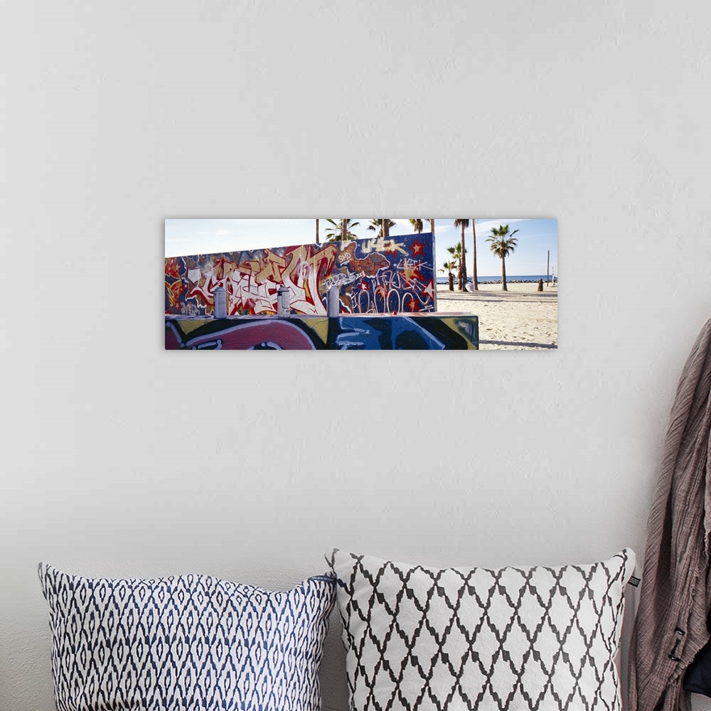 A bohemian room featuring Horizontal, large photograph of two walls covered with graffiti art in Venice Beach, California. ...