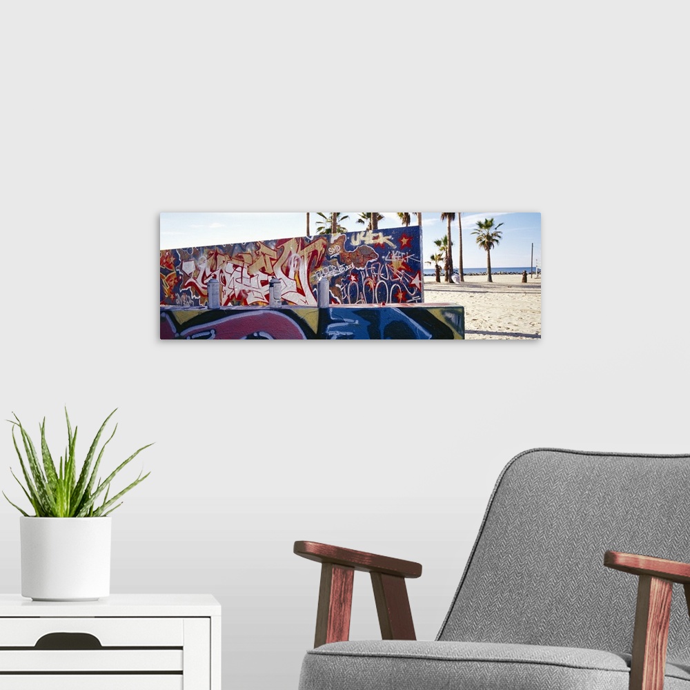 A modern room featuring Horizontal, large photograph of two walls covered with graffiti art in Venice Beach, California. ...