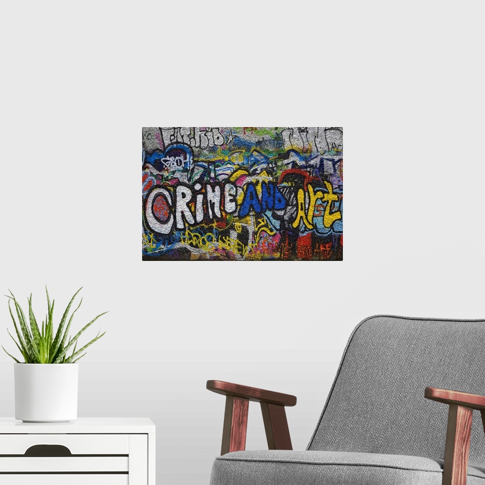 A modern room featuring Panoramic photograph of colorful spray painted street art on a brick wall.