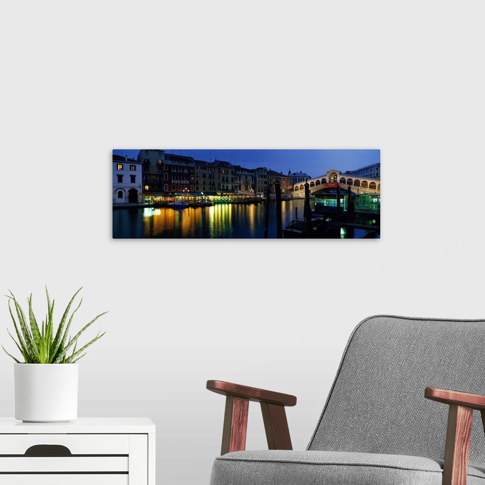 A modern room featuring Panoramic photograph displays the oldest overpass of a famous waterway in Europe as it spans two ...
