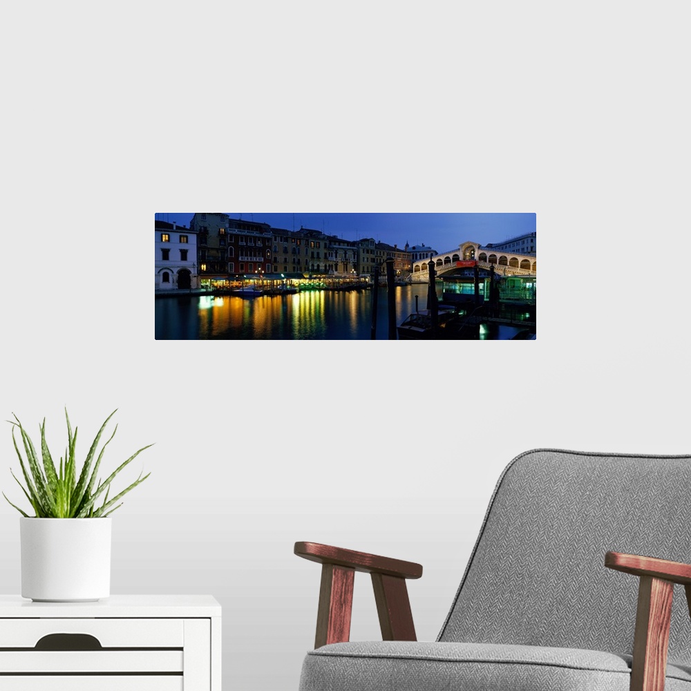 A modern room featuring Panoramic photograph displays the oldest overpass of a famous waterway in Europe as it spans two ...