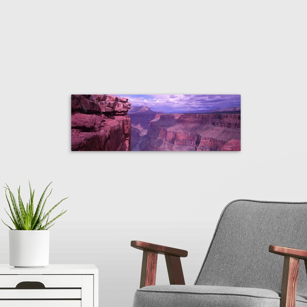 A modern room featuring Panoramic photograph displays a look down the stretch of a famous chasm in the Western United Sta...