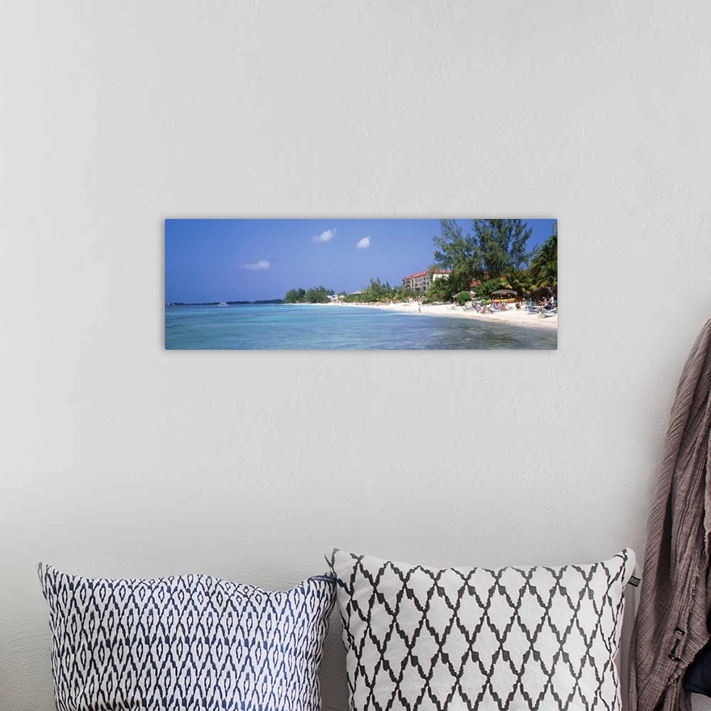 A bohemian room featuring Grand Cayman, Cayman Islands, 7 Mile Beach, Tourists on the beach