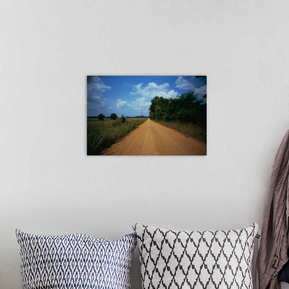 A bohemian room featuring Gravel road passing through a field, Arkansas